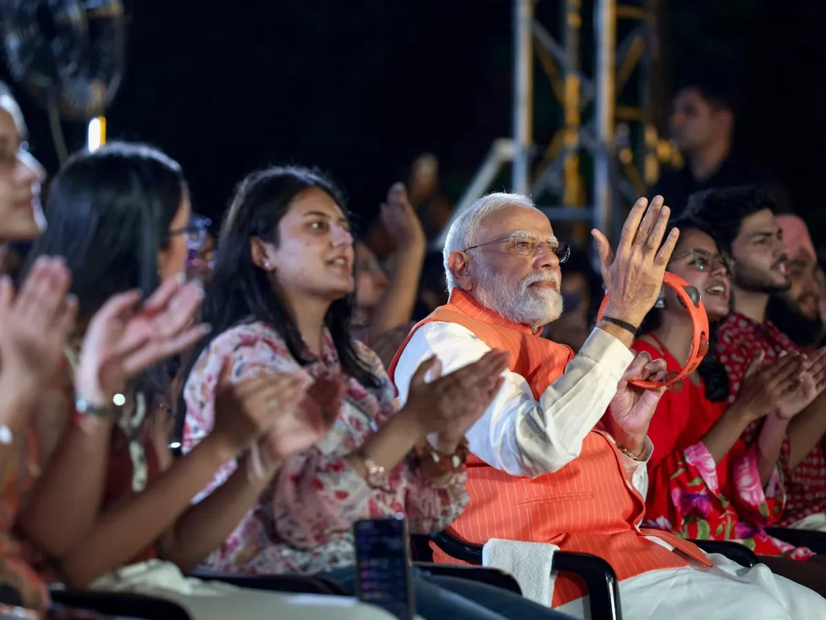 PM Modi Joins ‘Bhajan Clubbing’ With Gen Z in Delhi, Plays Instrument at Deendayal Upadhyaya Event